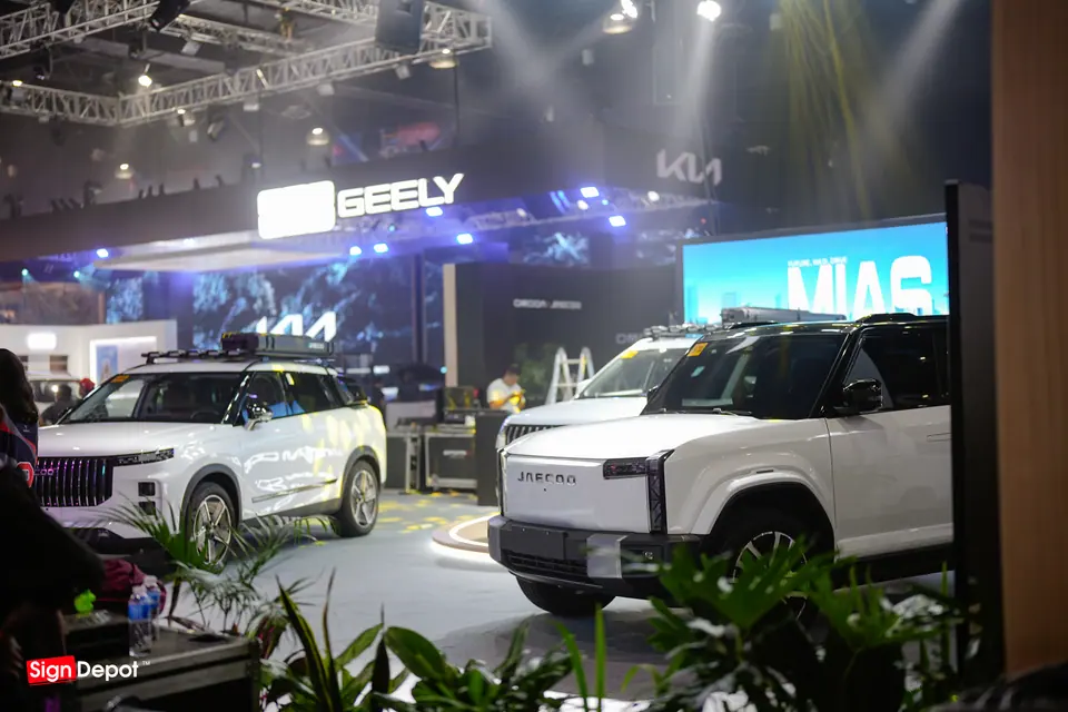 The Geely booth with its LED wall and display cars