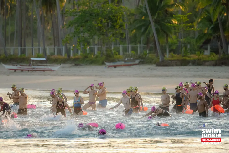 The mass start: swimmers run into the sea